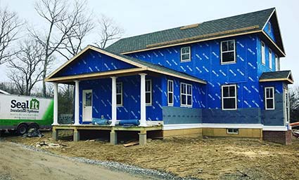 Sealing up the shell of this hilltop custom house in Maine.